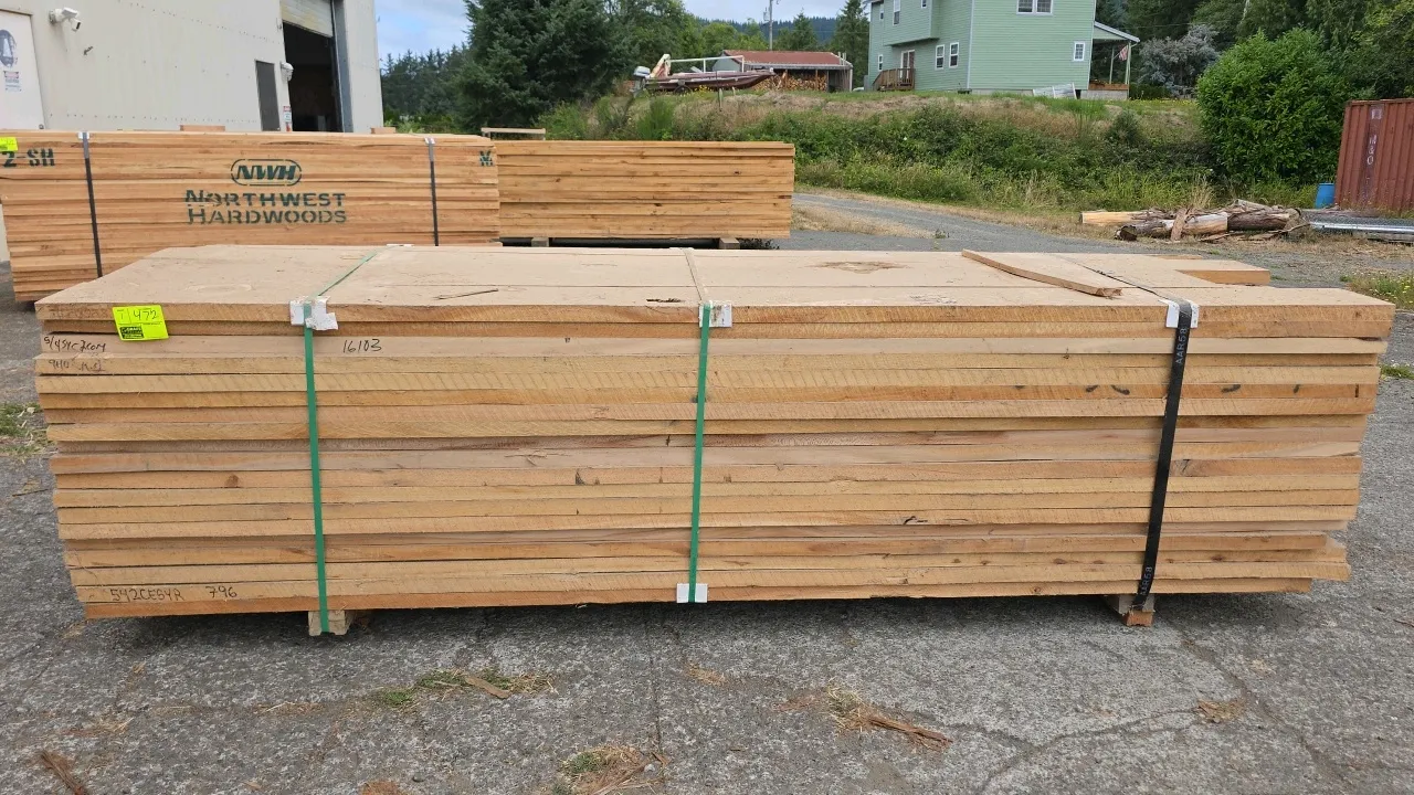 Sycamore hardwood lumber bundle. Approx. 10'L x 1-1/4" thick (5/4). Marked 1,045 board feet (BF: 1045), bundle # 198088, and 5/4 SYC 2 COM KD. Steel-b