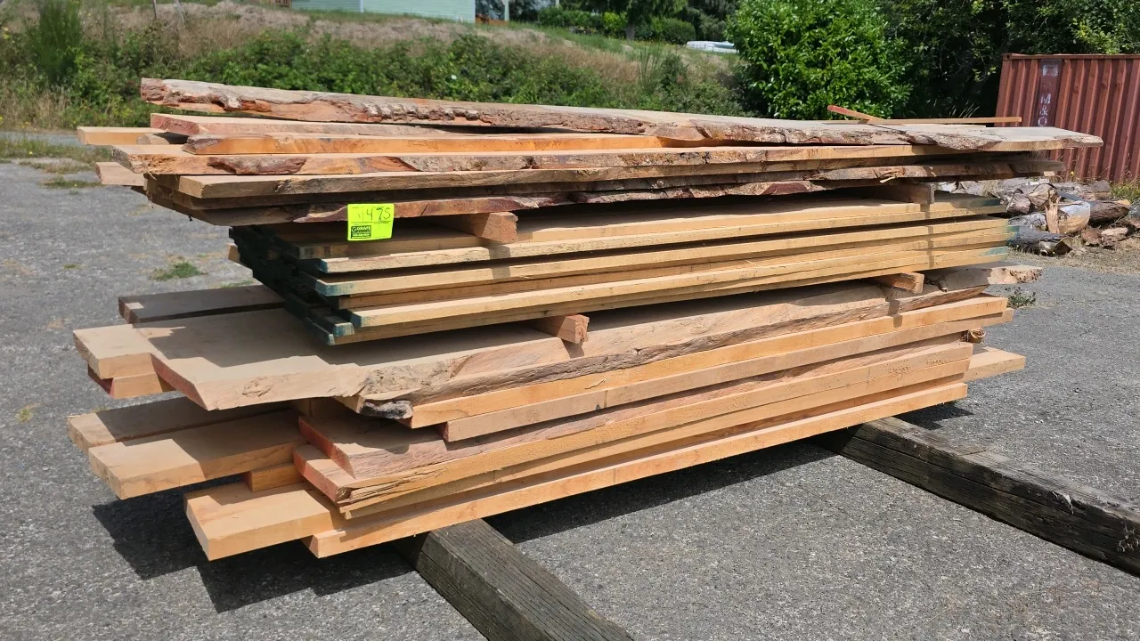 Stack of assorted hardwood lumber. Features a mix of live-edge and rough-sawn boards. Dimensions: approx. 8' to 10'L x 1", 1-1/4", and 2" thick.