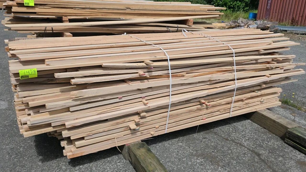 Assorted hardwood lumber bundle. Features varied thicknesses of 1/2", 1", and 1-1/2"T. Approx. 10'L.
