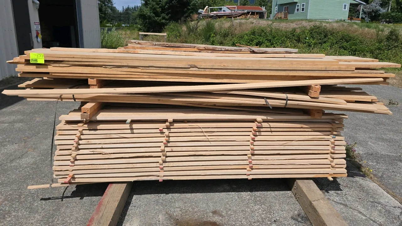 Stack of assorted hardwood lumber. Approx. 8' to 10'L with thicknesses ranging from 1/2" to 1-1/2"T. Features stacked layers with wood stickers/spacer