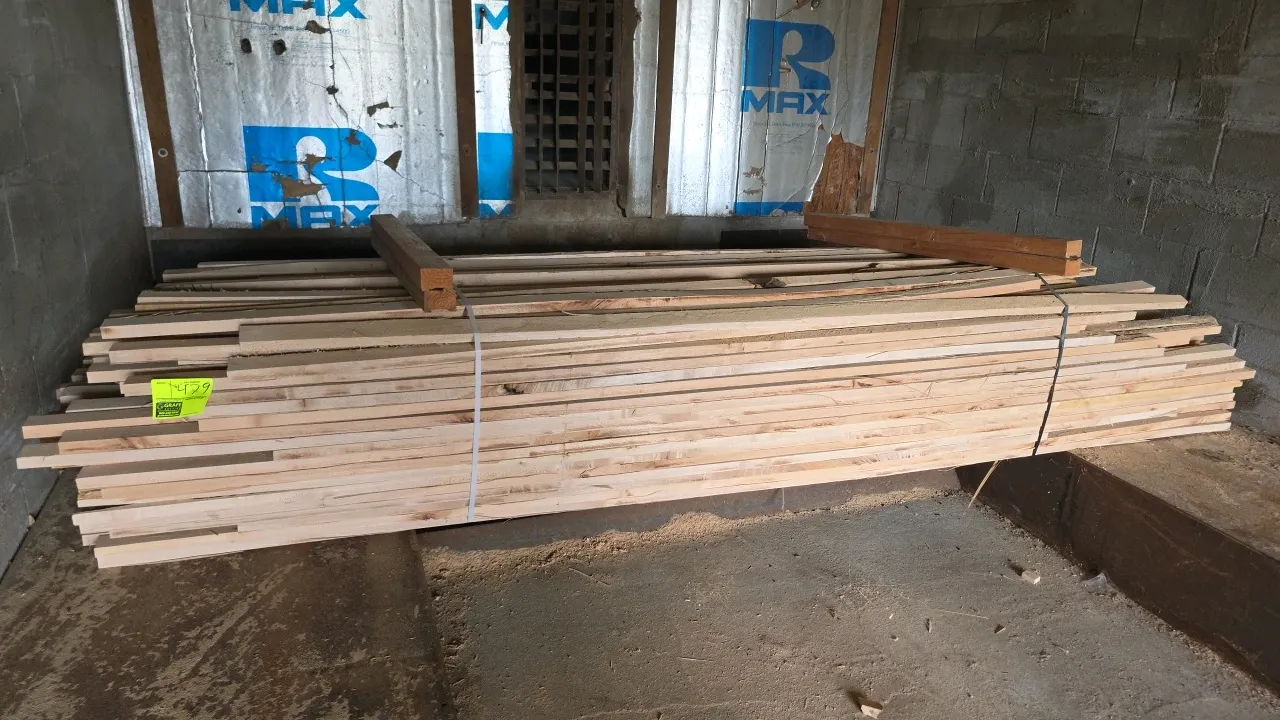 Bundle of assorted hardwood lumber. Features various board widths, banded with top spacer blocks. Approx. 10'L x 1"T.