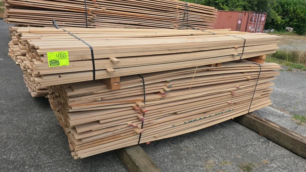 Bundles of alder hardwood lumber. Banded in stacks with wooden spacers. Approx. 8'L x 1/2"T.