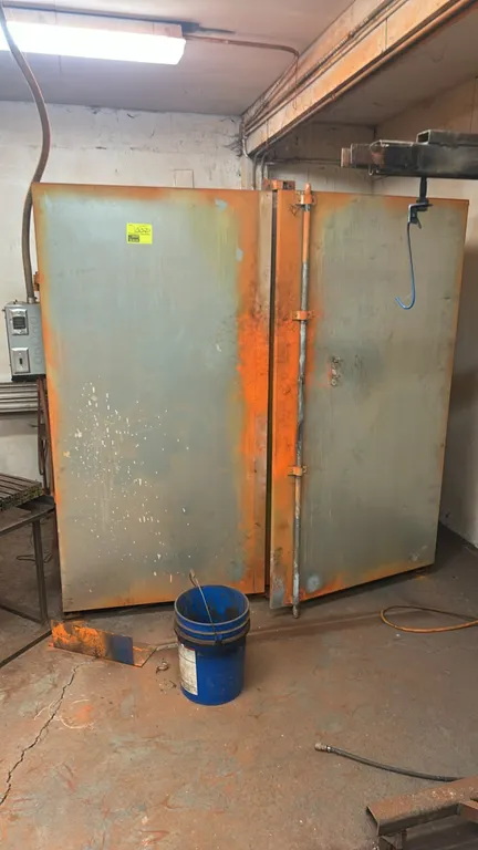 Metal 2-door industrial heating booth. Features double swinging doors with locking bar latch, side-mounted control box with digital temperature contro