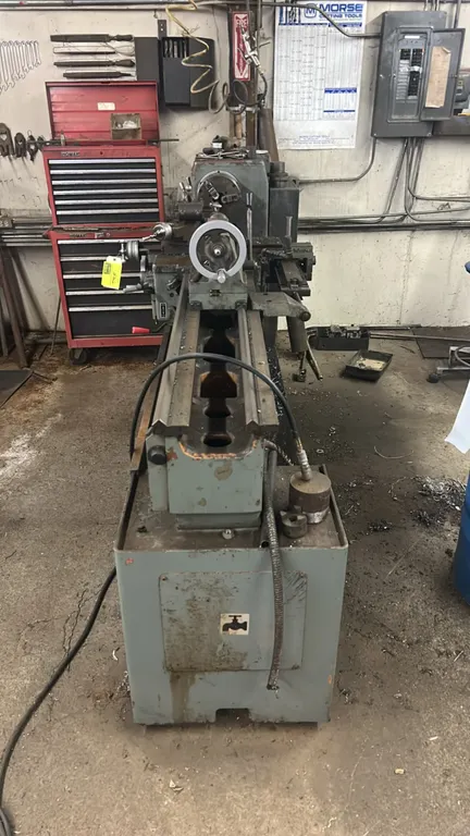 1984 Goodway GW-1660 geared-head engine lathe. Features 3-jaw chuck, tool post, tailstock, chip tray, and includes assorted lathe files and large dril