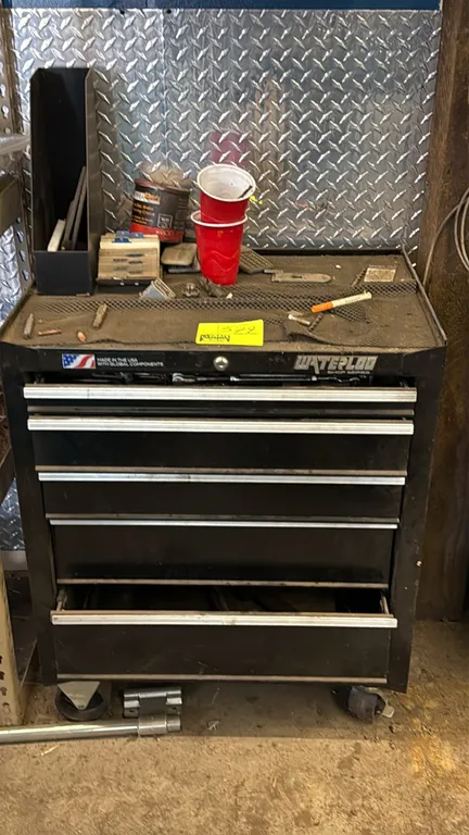 Waterloo Shop Series 5-drawer portable tool cabinet with assorted contents. Features 5 pull-out drawers, keyed lock mechanism, top work mat, and assor