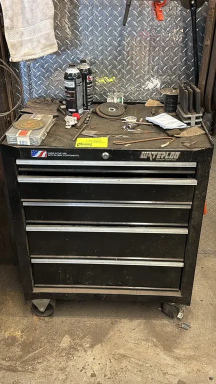 Waterloo Shop Series 5-drawer portable tool cabinet. Includes keys, assorted hand tools, sanding flap discs, and shop accessories. 26.5"W. Mounted on