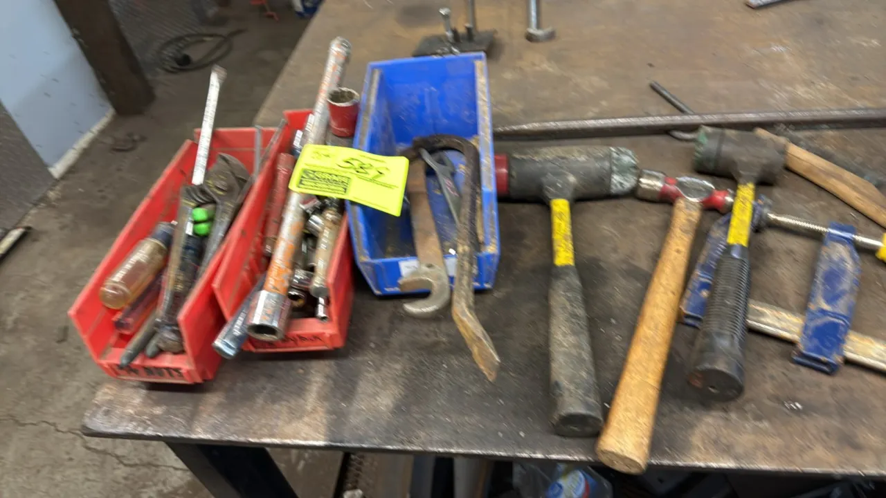 Assorted hand tools and storage bins. Includes dead blow hammers, ball-peen hammer, rubber mallet, Irwin bar clamp, pry bar, spanner wrenches, pliers,