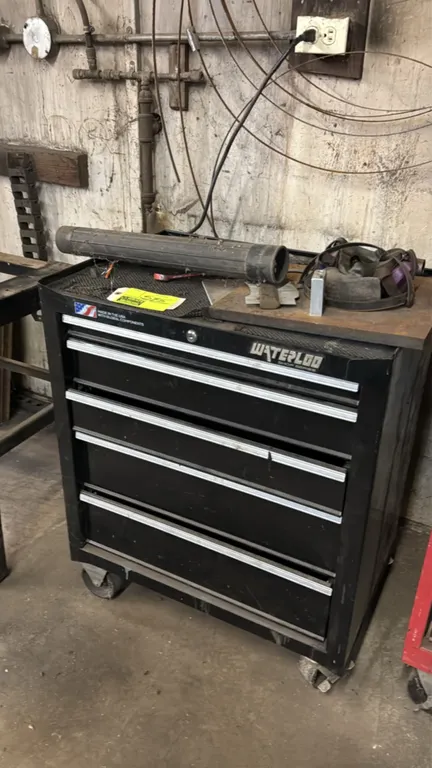 Waterloo Shop Series 5-drawer rolling tool cabinet. Features black steel construction and five full-width drawers with extruded aluminum trim. 26.5"W.