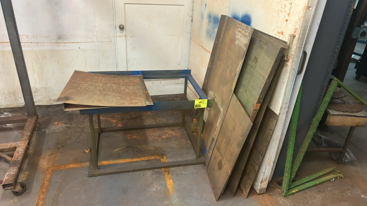 Welded steel frame with assorted sheet metal panels and shields. Features angle iron and tube steel construction.