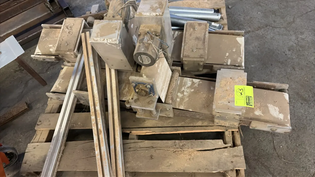Pallet lot of assorted conveyor and machinery parts. Includes conveyor rollers, motorized conveyor assembly, aluminum extrusion rails, pneumatic cylin