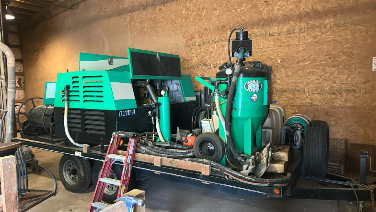 16' dual-axle flatbed trailer package. Includes 2014 Dustless Blasting DB-800 sand blaster (S/N: 27 D14) and Sullivan-Palatek DF210PHJD air compressor
