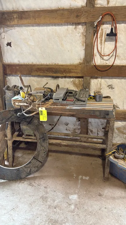 Delta Milwaukee wood lathe with wood lathe duplicator attachment and tool kit. Features multi-step pulley headstock, duplicator assembly, and assorted