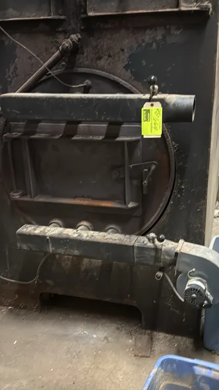 Biomass Combustion Systems Wood Shop Model 36 central/supplementary wood furnace. Features heavy-duty steel construction, upper and lower access doors