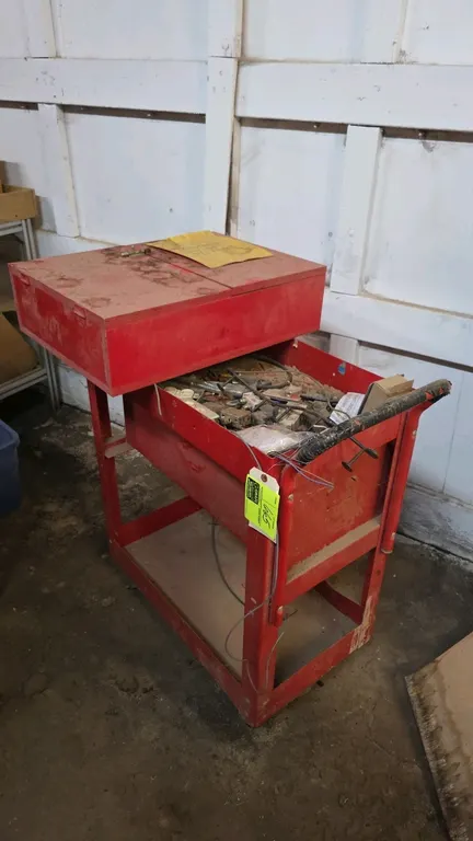 Metal 3-drawer tool cart. Features a red finish, pull-out drawers with aluminum-tone pulls, side push handle, top compartment, and lower storage shelf