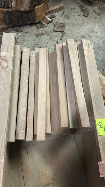 Assortment of hardwood table legs. Features unfinished square-cut hardwood blanks.