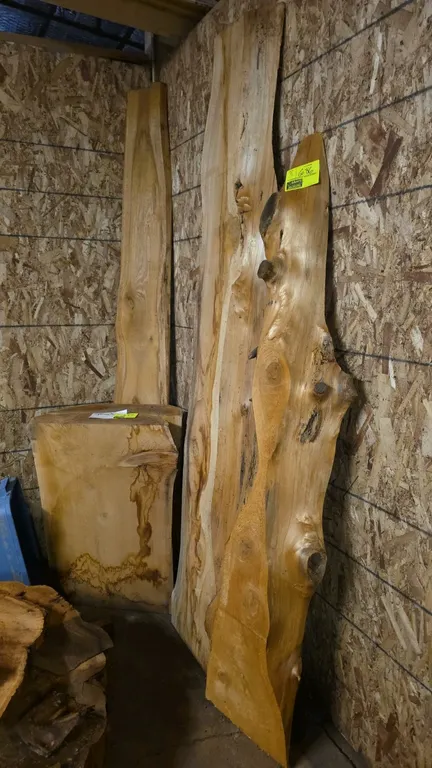 Live edge cedar boards. Features natural live edges and prominent wood grain patterning. 90"L x 19"W x 6"H.