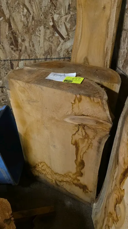 Live edge cedar boards. Features natural live edge sides and wood grain. 26"L x 8"W x 34"H.