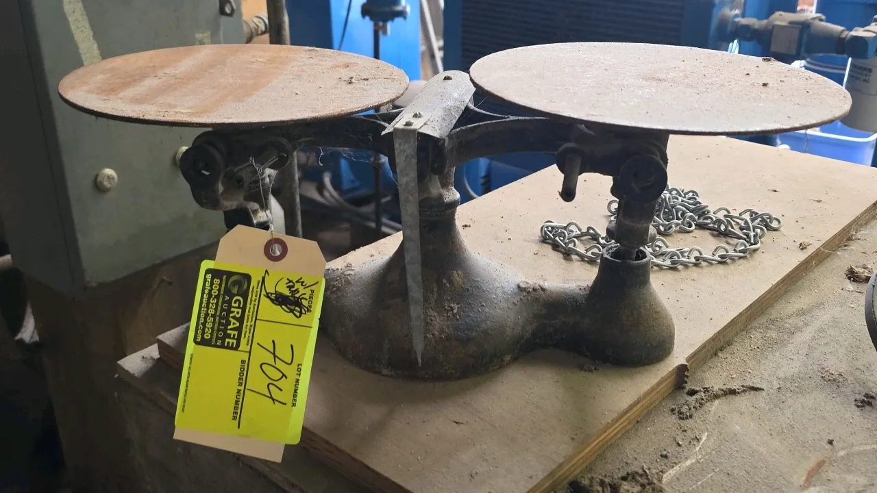 Counterbalance scale with wood work table. Features dual-plate cast iron balance scale mechanism. Includes 44" x 43" wood work table.