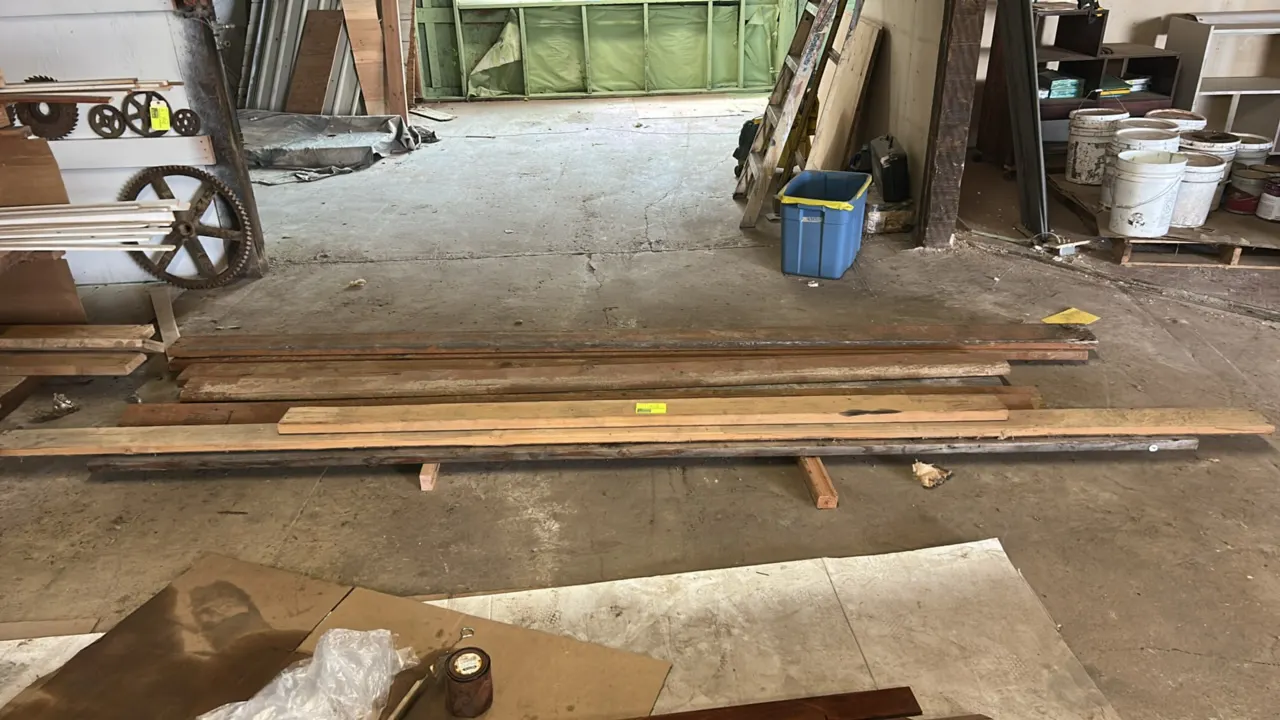 Assorted hardwood planks. Features various lengths and widths of hardwood boards.
