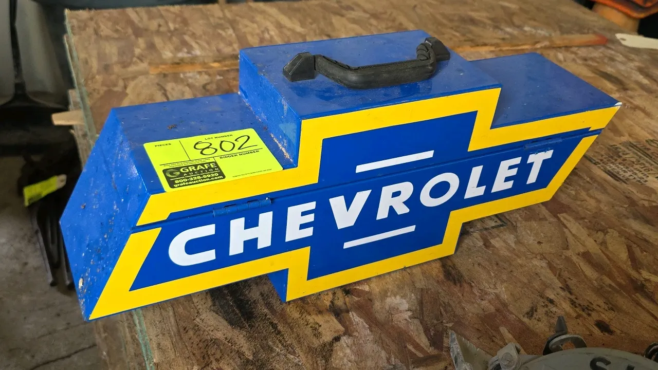 GoBoxes BT 1000V Chevrolet bowtie portable metal tool box. Features Chevrolet logo design, dual latch closures, and top carry handle. GM officially li