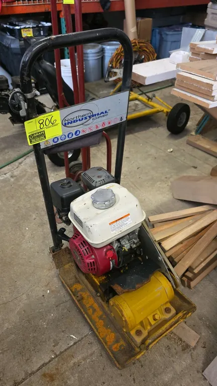 2013 Northern Industrial JPC-60 gas-powered plate compactor. Powered by a Honda GX160 gasoline engine. Features a 375mm x 336mm plate and folding hand