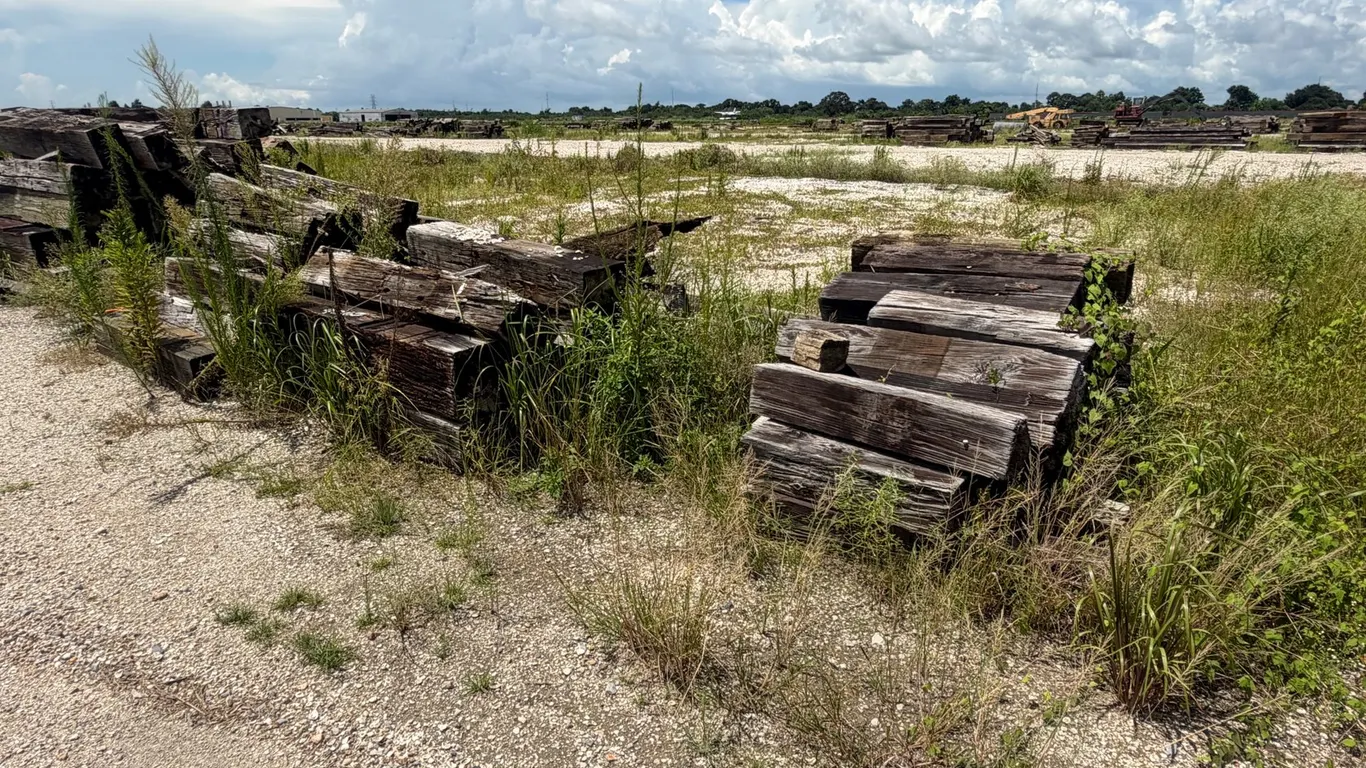 THREE PILES OF RAILROAD TIES