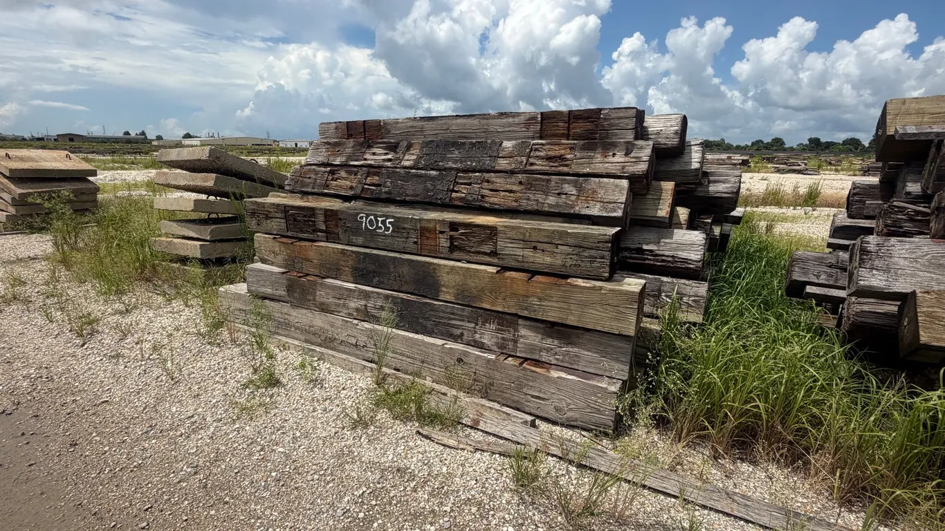 PILE OF RAILROAD TIES AND CONCRETE PAVERS