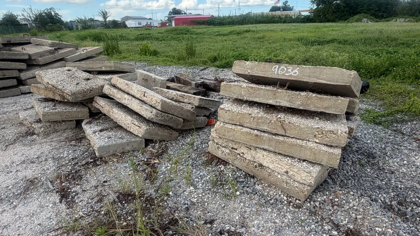 PILE OF CONCRETE PAVERS AND WOOD