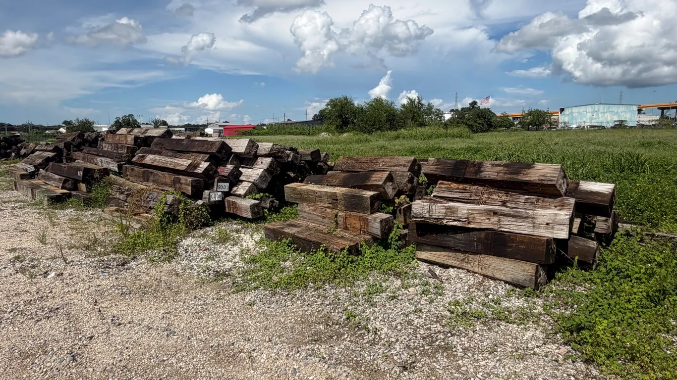 FIVE PILES OF RAILROAD TIES
