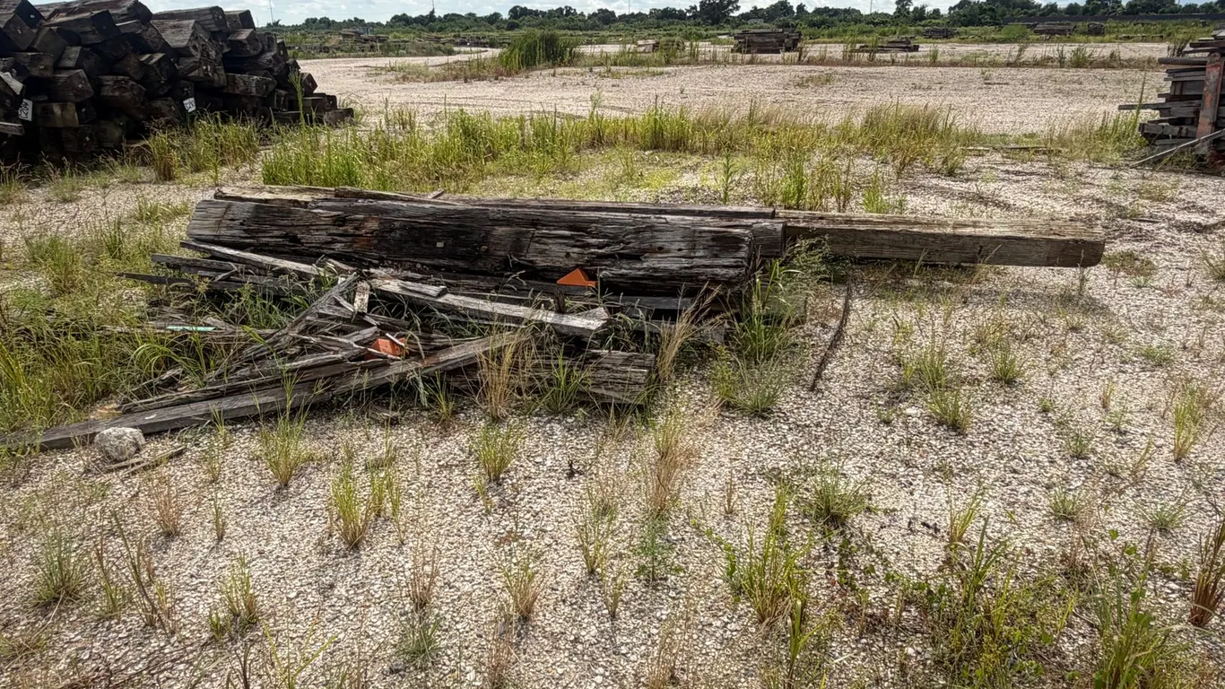 PILE OF RAILROAD TIES AND LUMBER