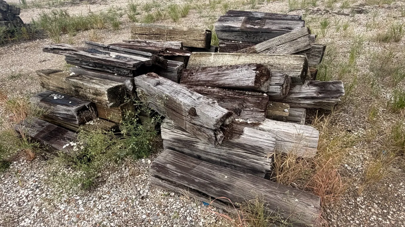 TWO PILES OF RAILROAD TIES
