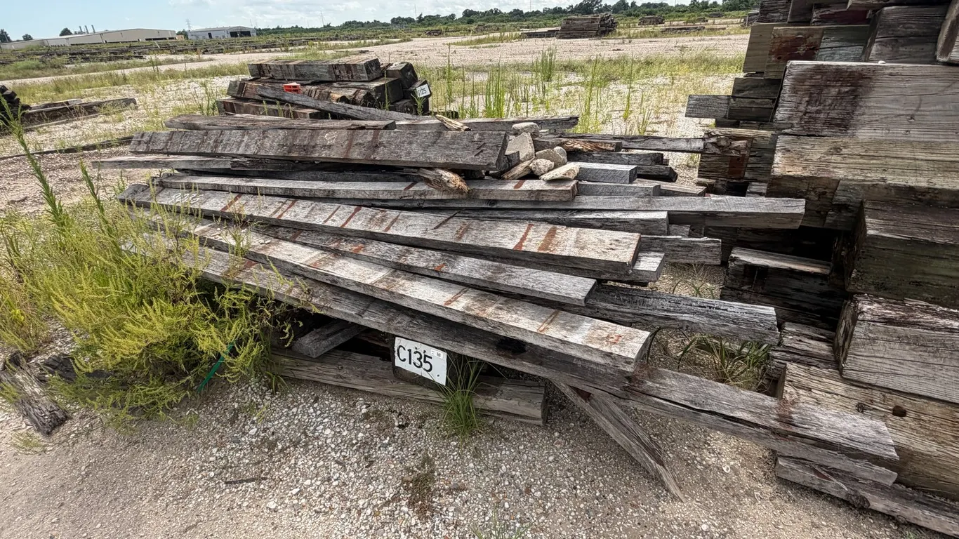 PILE OF RAILROAD TIES AND LUMBER