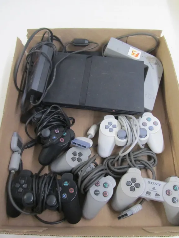 (2) Sony PlayStation 2 Consoles w/(5) Controllers