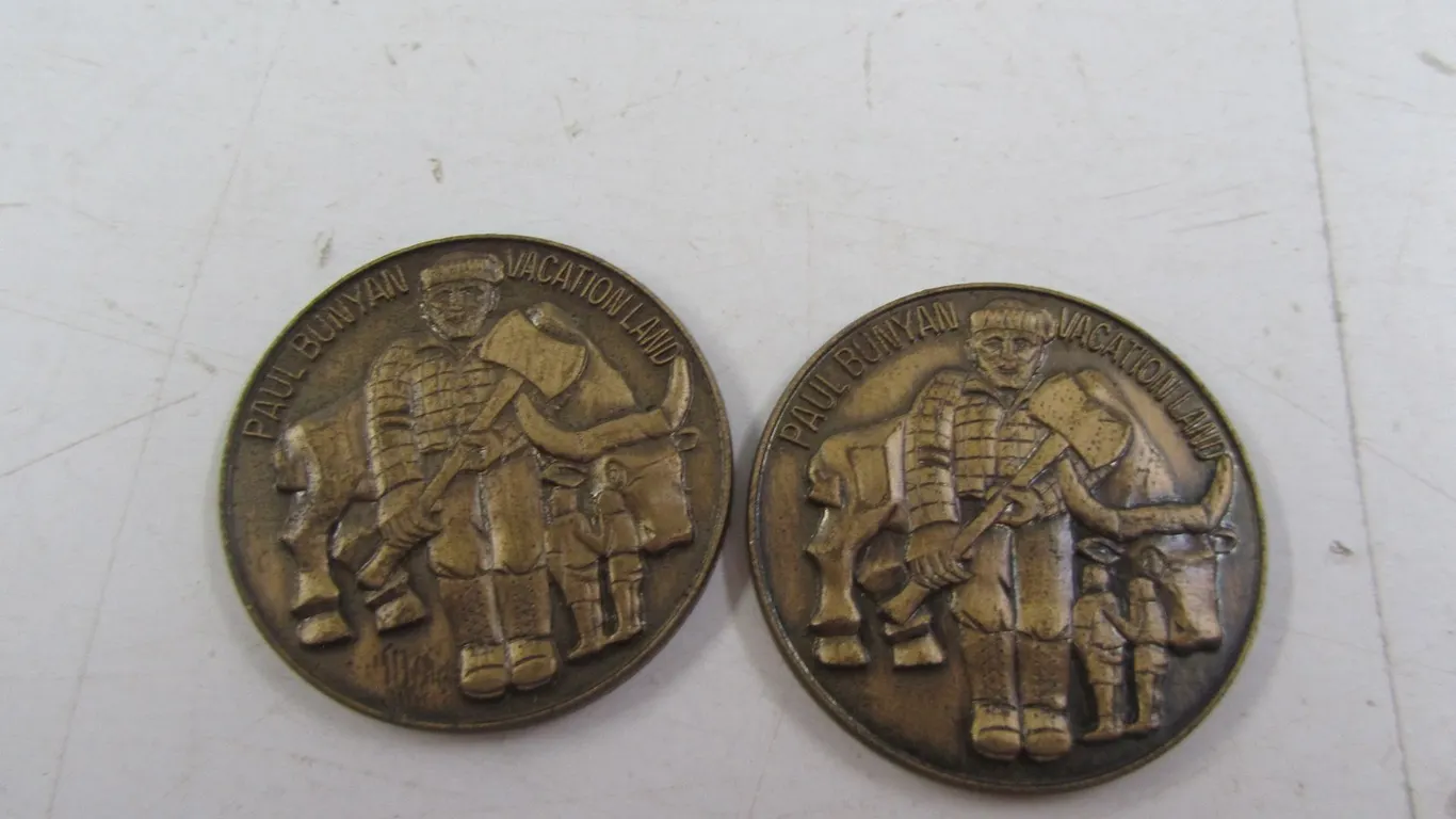 (2) Paul Bunyan Vacationland Tokens