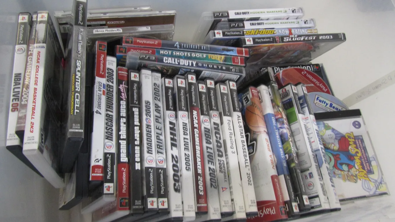 Tub Full Of Assorted PlayStation 1, 2, And 3 Games
