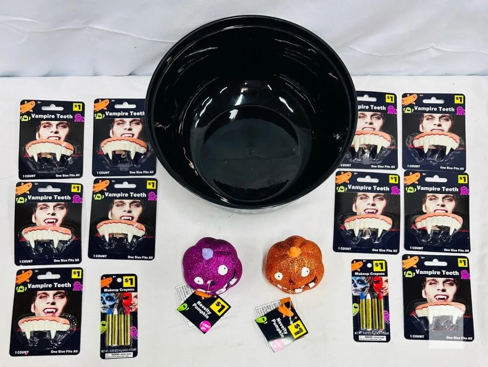 10 Vampire teeth, 2x4 Makeup Crayons, 2 Small Novelty Pumpkins, 1 bowl.