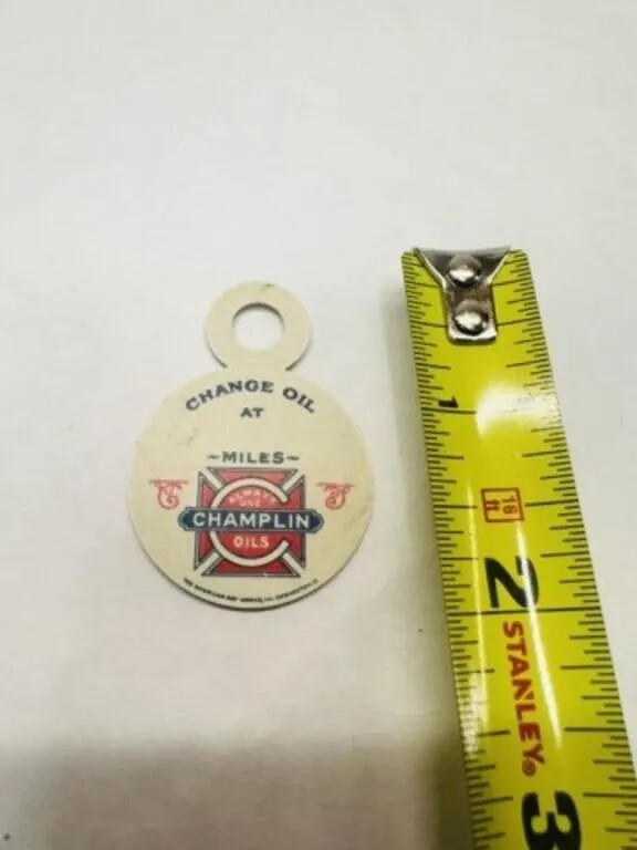Tin Champlin Oil change reminder tag to be hung on