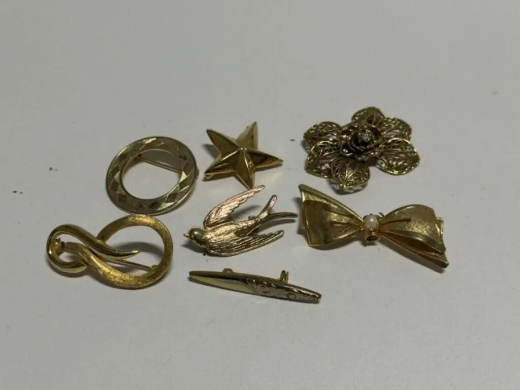 7 gold tone Brooches, Bird, Flower, Star, Circle,