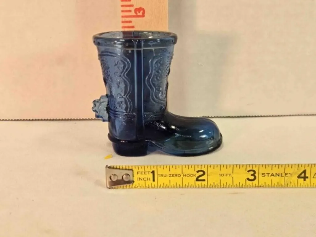Blue glass boot & spur, stamped Made in Taiwan