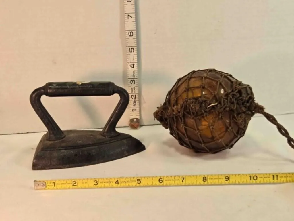Cast iron sad iron & amber hanging globe