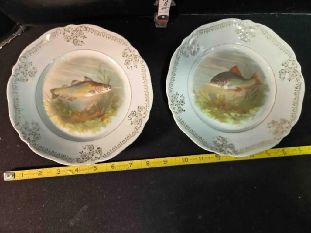 2 porcelain cabinet plates featuring fish motif