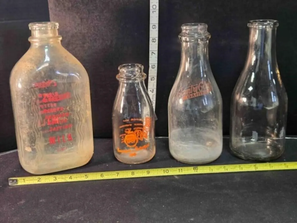 4 vintage milk bottles; Gold Spot, Colvert's,