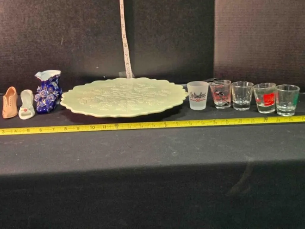 White platter, 3 porcelain shoes, 5 shot glasses