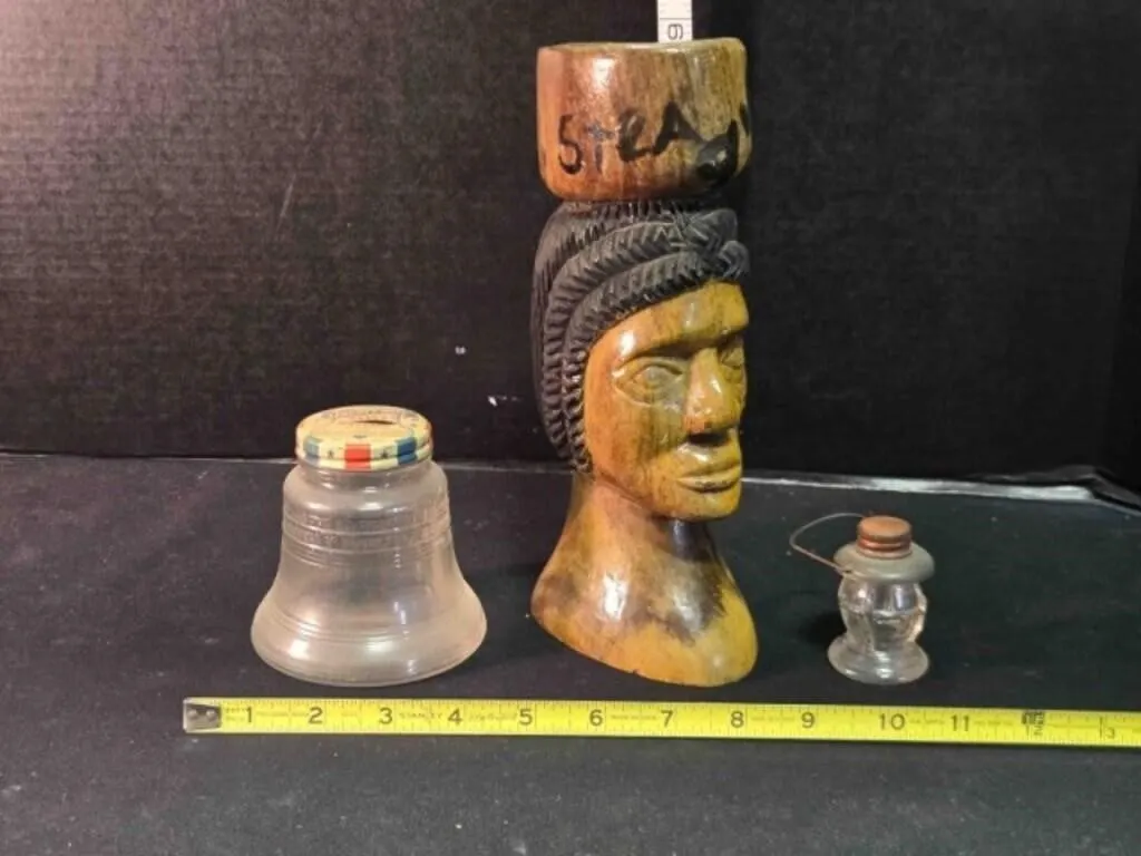 Wood Jamaica bust, glass bell bank, glass lantern