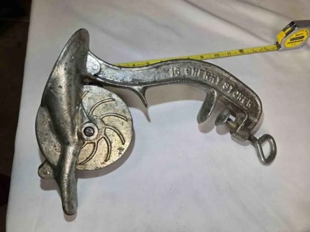 Vintage hand-cranked cast iron cherry stoner