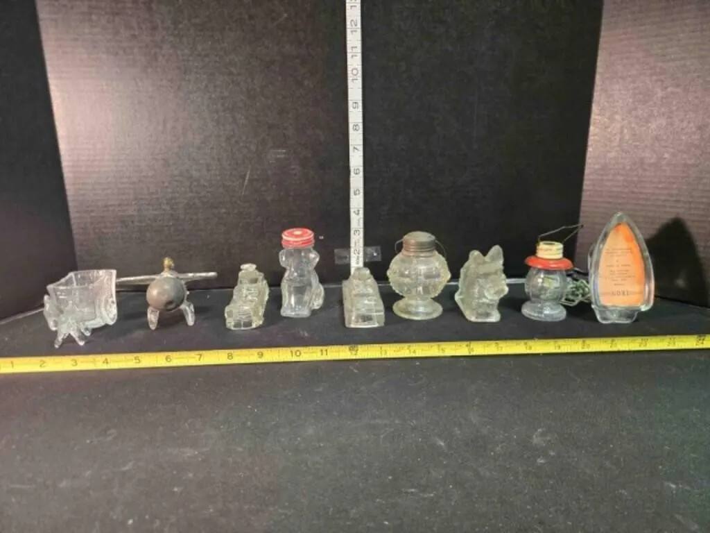 9 glass figurines; Scottie dog, lamp, iron,