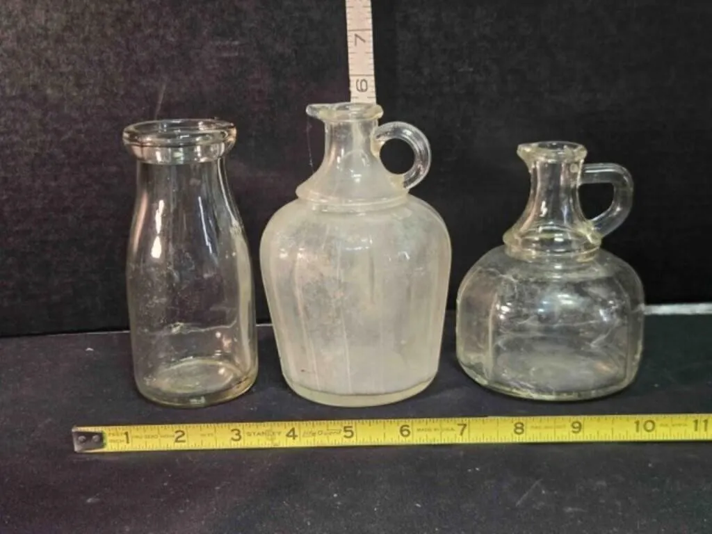 3 clear bottles, 5 3/8", 5�", 4�" tall