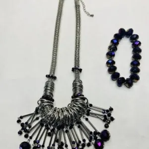 Silver tone statement necklace w/dangling metal ri