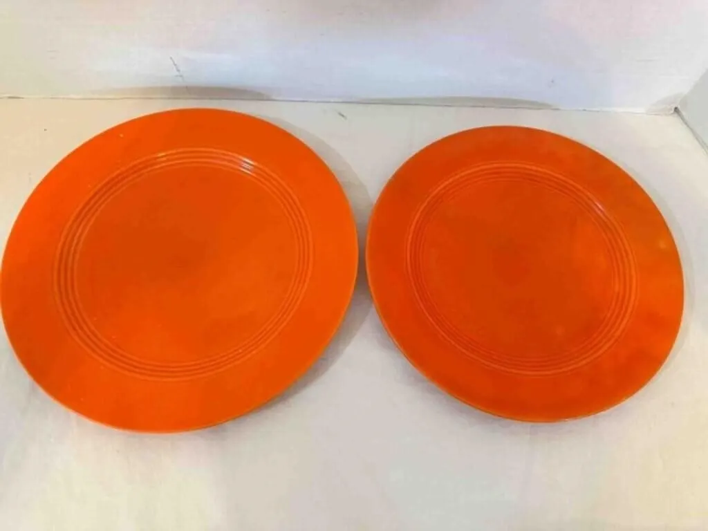 2 Orange Harlequin dinner plates, 9.25"& 10"