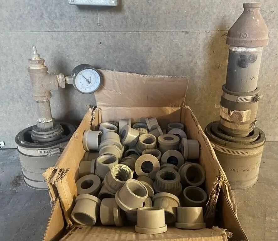 Box of PVC reducing bushings and adapters, and